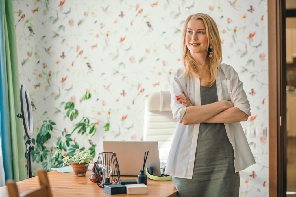 Blonde woman standing confidently in an office