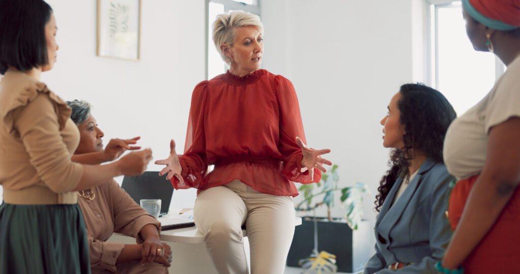 Woman presenting at the front of a room