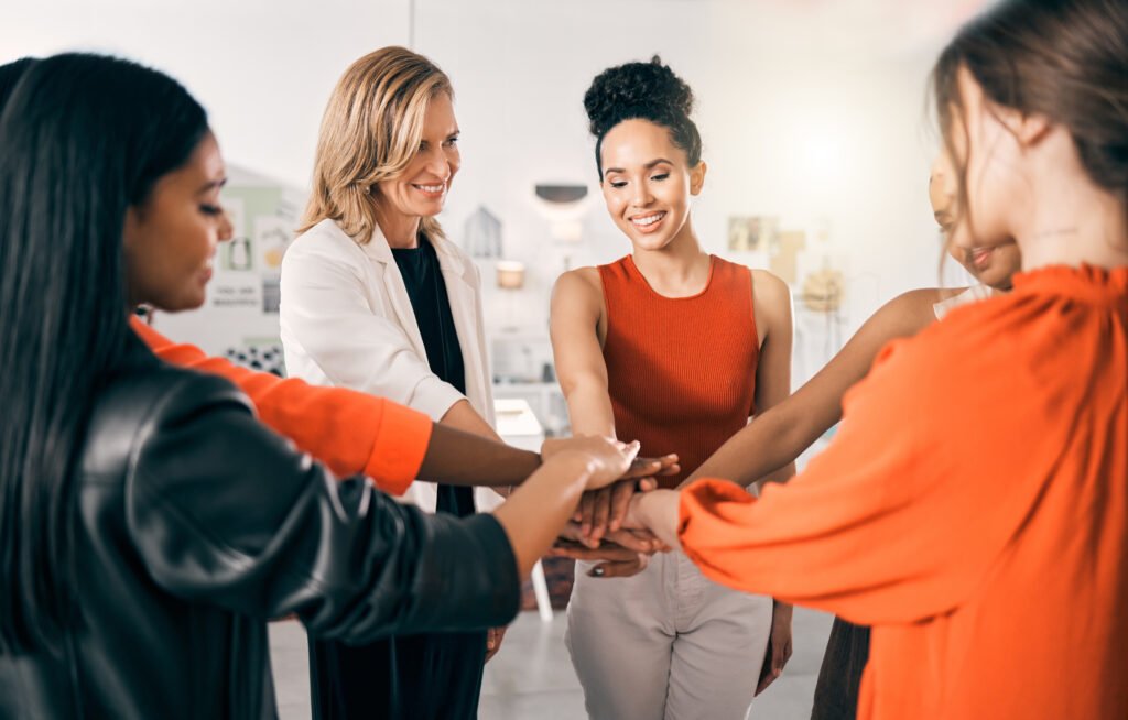 Women joining hands, the free Discord community for purpose-driven entrepreneurs