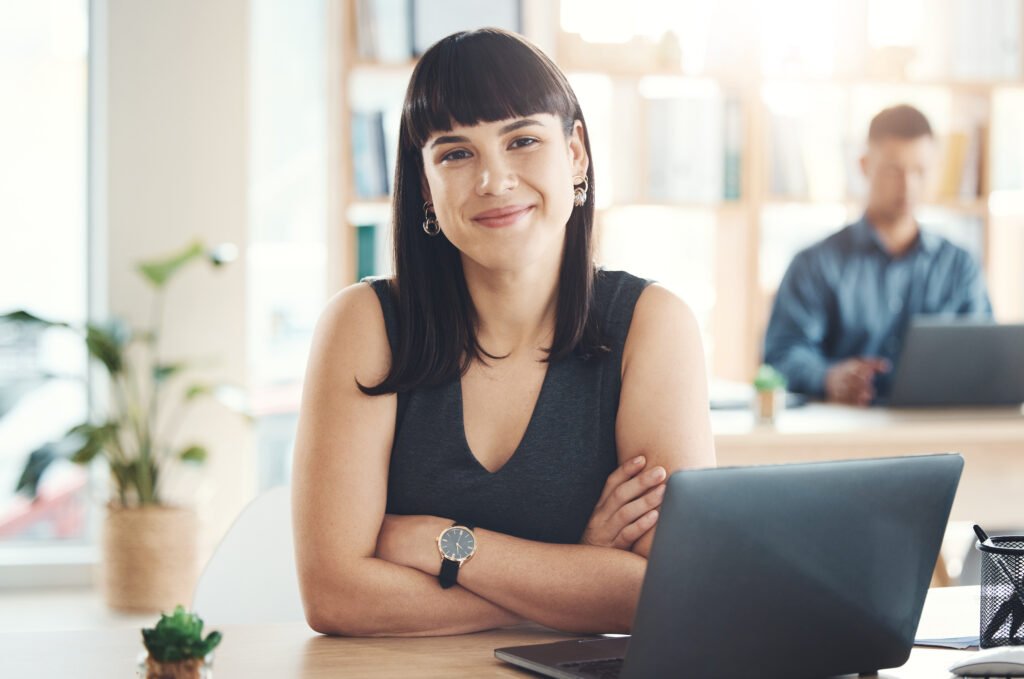 Confident woman at a desk in an office