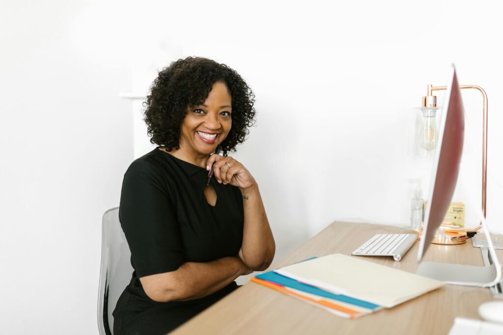 Black woman at a computer in an office