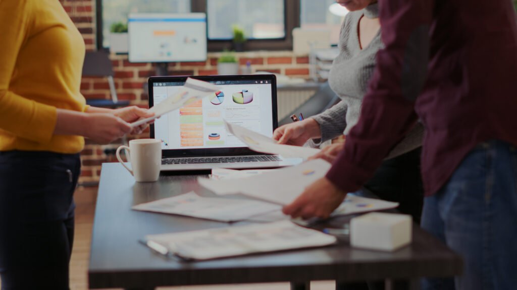 People reviewing charts and reports together